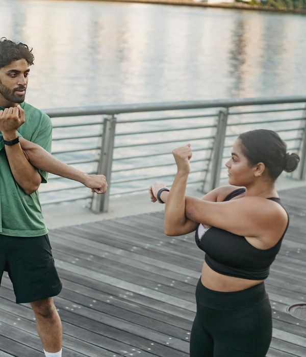 Man stretching outdoors feeling refreshed and energetic.